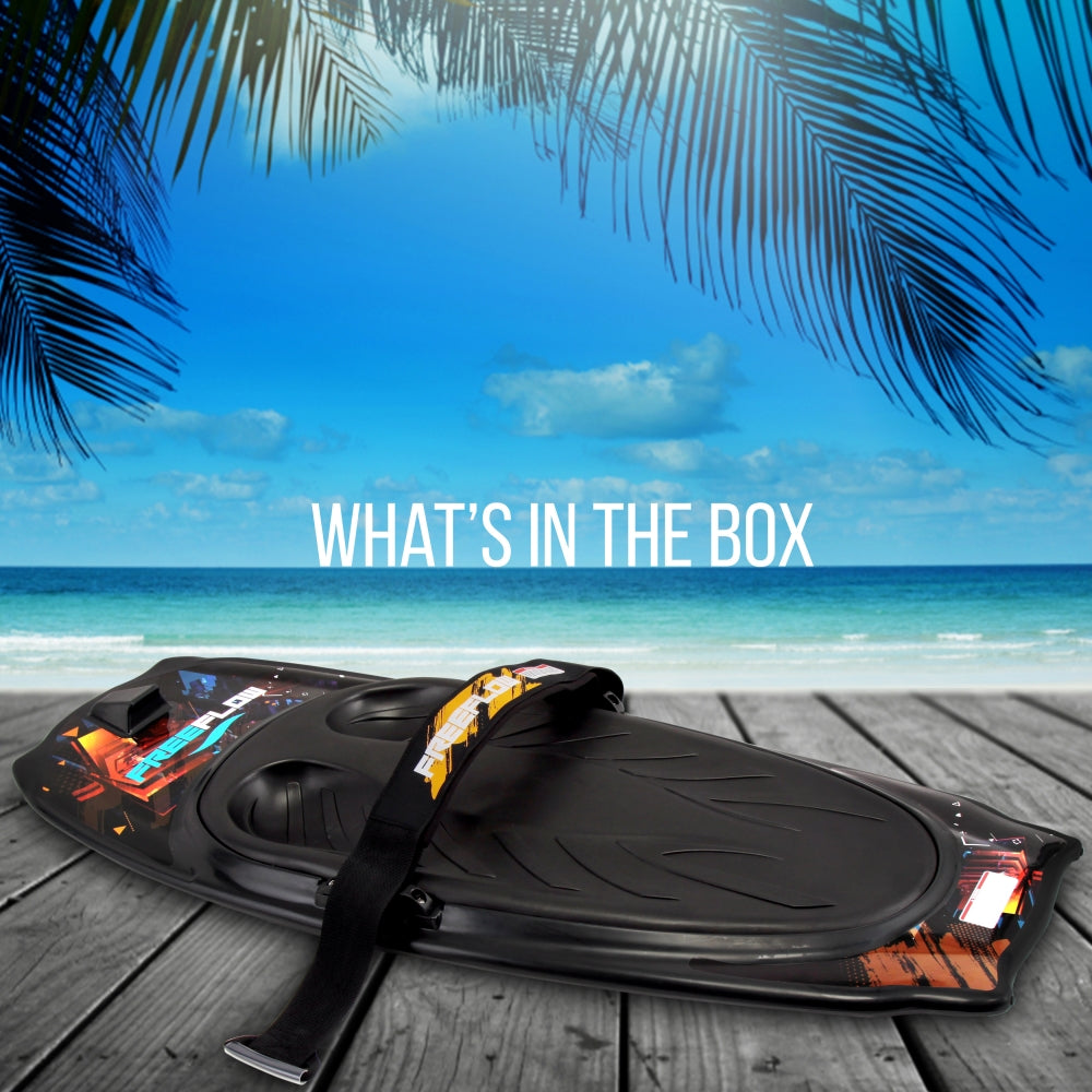 Black surfboard with straps on a wooden deck with a tropical beach background