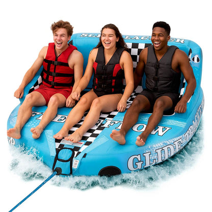 Three people on a blue inflatable tube with checkered pattern in water