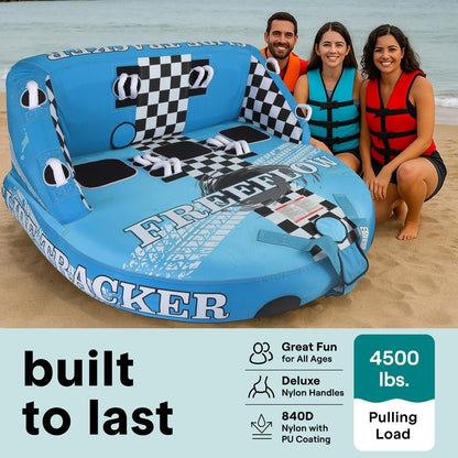 Inflatable pool float shaped like a car with people sitting on a beach.